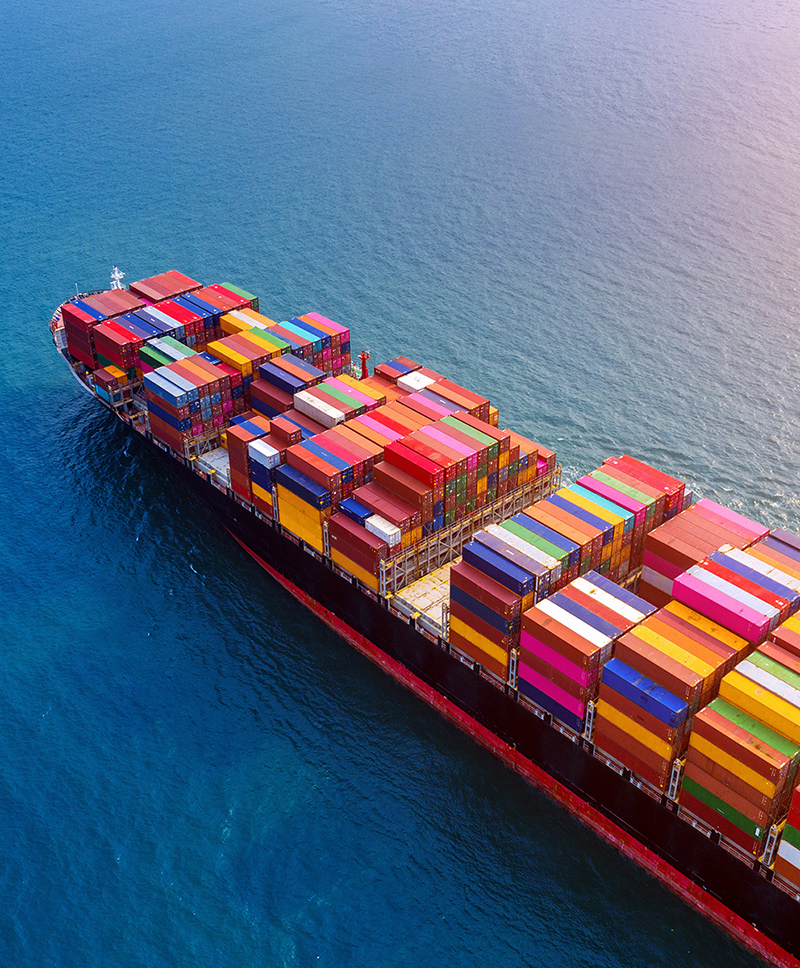 Aerial view of container cargo ship in sea.